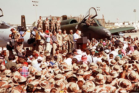 President George Bush speaks to U.S. Military personnel gathered for his Thanksgiving holiday visit during Operation Desert Storm. (Department of Defense/Gerald Johnson)