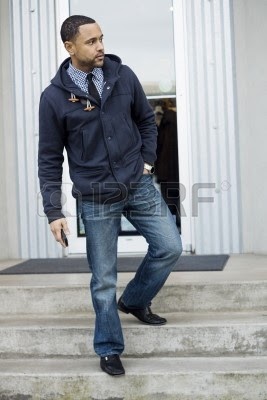 http://us.123rf.com/400wm/400/400/sketchyt/sketchyt1208/sketchyt120800013/14731430-young-black-man-standing-on-light-colored-storefront-steps-looking-to-the-right.jpg